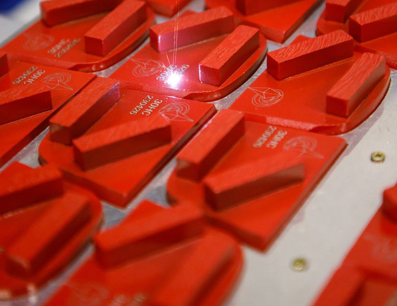 red QC metals engraving